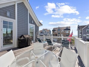 Private balcony with outdoor dining space, perfect for enjoying meals with a view.