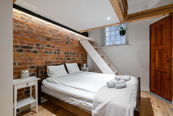 The apartment has two separate sleeping areas. A bedroom and an alcove. The alcove has a double bed and a loft.
