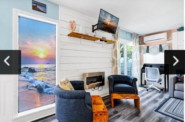 Cozy sitting area with fireplace.