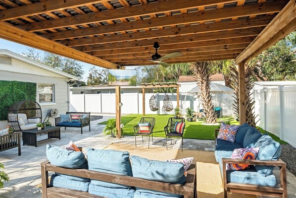 Unwind in style under the spacious 16x16 pergola with your favorite shows on the outdoor smart TV.
