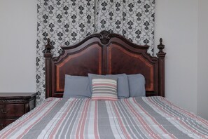 Primary bedroom with king size bed.