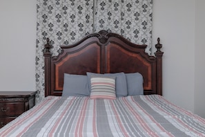 Primary bedroom with king size bed.
