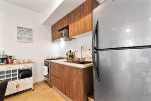 Cook in style! Our stocked kitchen has a microwave, fridge, coffee maker & 4-burner stove.