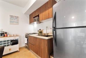 Cook in style! Our stocked kitchen has a microwave, fridge, coffee maker & 4-burner stove.