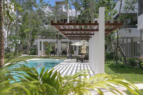 Dive into luxury at our pool with a spacious shallow end and loungers.