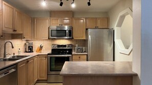 Kitchen with stainless steel appliances.