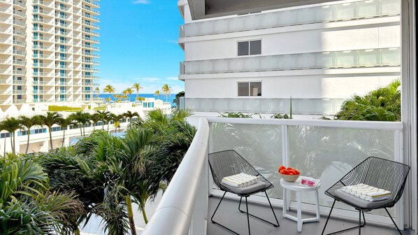 Private Balcony | Ocean view with a conversation seating area.