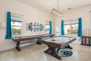 Enjoy endless games on this spacious pool table and shuffle board!