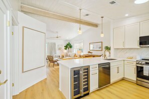 Upon entering the home, you are greeted by the fully stocked kitchen.