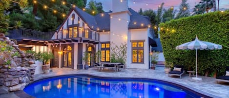 Serene pool view at dusk, reflecting the evening sky.