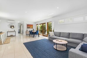 The spacious, light-filled living area creates a welcoming atmosphere