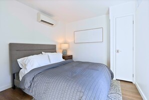 Unwind in this serene and comfortable bedroom with plush bedding.