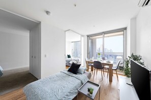 The living area with a 3-seater sofa bed which folds out to king single.