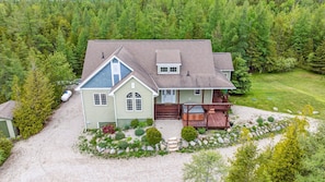 A stunning aerial view of Casa Giulia, tucked into a 16-acre private estate surrounded by lush Northern Ontario forest—your secluded luxury escape.