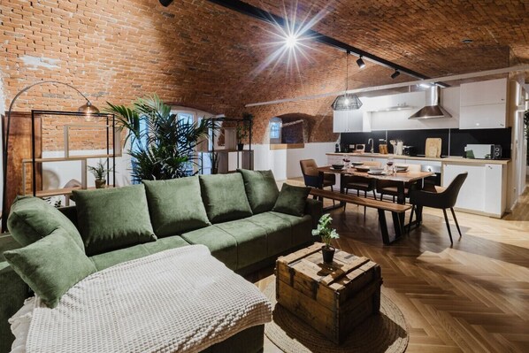 Open-concept living and dining space with plenty of natural light and seating.