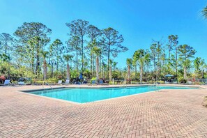 Communal outdoor pool and sun loungers