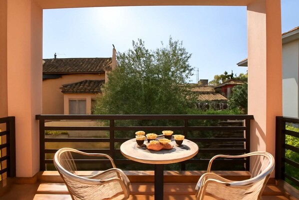 Enjoying a coffee on the sunny balcony
