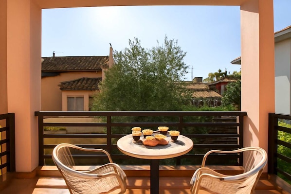 Enjoying a coffee on the sunny balcony