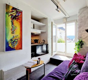 Sunny balcony, Google TV, amd homemade art