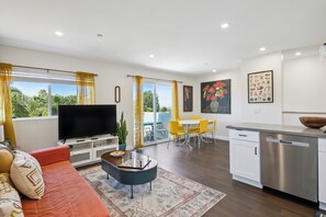 Open living concept with convenient spaces for dining and relaxation.