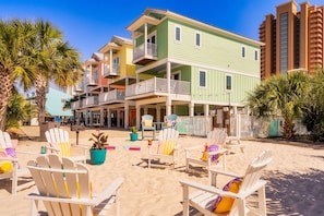 Unwind in our Adirondack chairs perfectly positioned on soft sand for private beach relaxation.