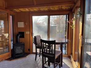 Sunroom: gas fireplace, patio and grill nearby