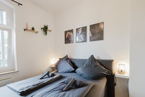 Fine décor and warm lighting make this bedroom a cozy haven.