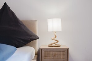 Charming bedroom accents with warm lighting and modern design elements.