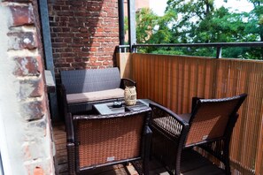 Here you can see the balcony with seating furniture.