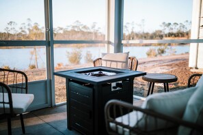 Enjoy the beautiful view of our backyard pond from the screened porch!