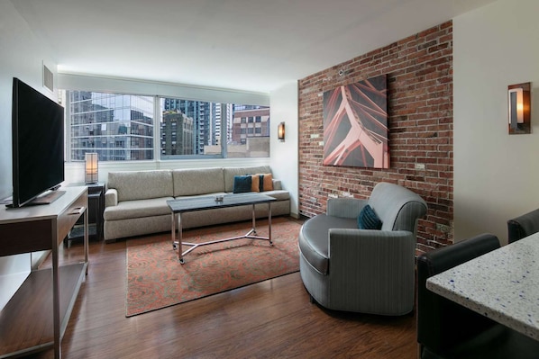 Living Area. Exact unit will be assigned upon arrival. Views, colors, and decor may vary.