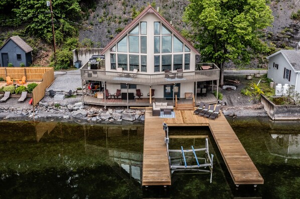Panoramic lake views, a stunning wall of windows, and a private U-shaped dock—your Cayuga Lake escape starts here.