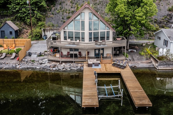 Panoramic lake views, a stunning wall of windows, and a private U-shaped dock—your Cayuga Lake escape starts here.