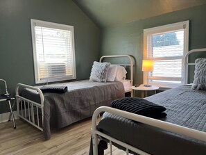 As you settle into the twin beds, you’re surrounded by a calming ambiance that promises a peaceful night’s sleep.