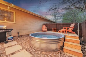 Rustic charm meets cool respite—a tiny cowboy pool and deck, a haven for laid-back moments under the big sky