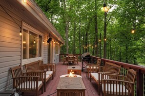 Enjoy the outdoors in your private deck with outdoor dining, grill and propane fire pit.