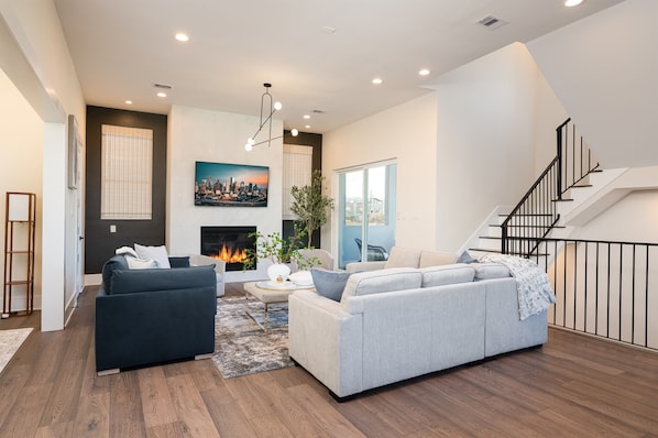Cozy fireplace, designer decor, and an open-concept living space. Perfect for families & groups looking for comfort and style.