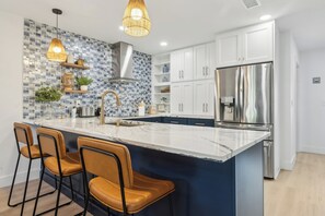 All electric stainless steel appliances including, Refrigerator, Oven, Stove, Microwave, Dishwasher, Toaster, Ice Machine, Wine Cooler, Toaster, Keurig Coffee Maker. Additionally, the kitchen counter top has 3 bar seats.