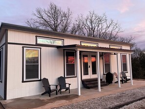 Front patio with infrared grill and plenty of seating to watch the sunset.