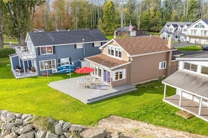 Nestled along the shore, this cozy getaway offers direct water access and a spacious deck for outdoor dining and relaxation.