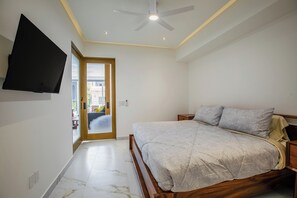 Spacious Bedroom - The quiet bedroom features a king-size bed, smart TV and ensuite bathroom