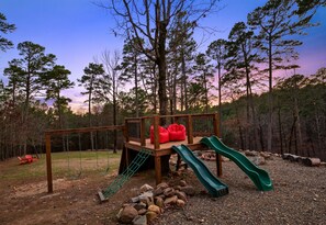 The kids will love this outdoor playset, complete with slides, swings, and plenty of space to climb and explore.