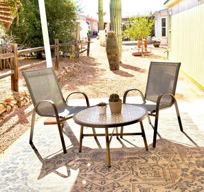 Enjoy birdsong and mountain vistas from the covered patio