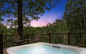 THe lower deck has a large hot tub with river views!