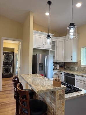 View of Kitchen & Laundry Room From Master Bedroom.