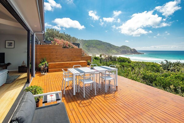 Sun-filled deck with stunning sea views any time of the day or night ...