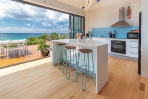 Spacious kitchen area with island for casual dining.
