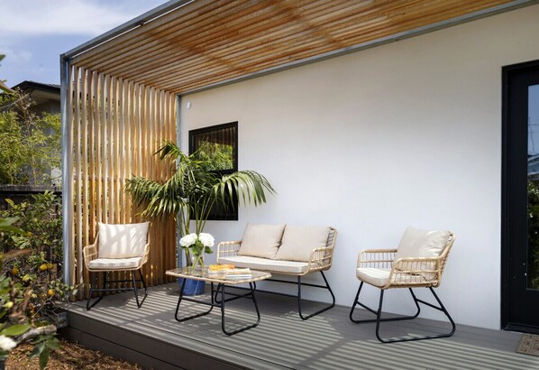 Relax and unwind in this cozy outdoor oasis. Perfect for soaking up the sun or enjoying a quiet afternoon!