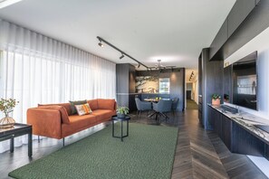 Open plan kitchen and living opens onto beachfront balcony
