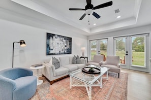 Cozy modern living room with chic décor and natural lighting.
